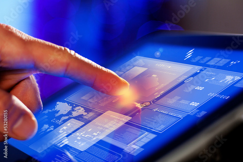 Photo: Closeup of finger touching tablet-pc screen Closeup of finger touching tablet-pc screen