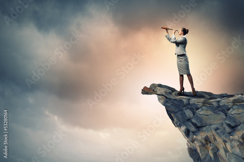 Photo: Business woman with telescope Business woman with telescope