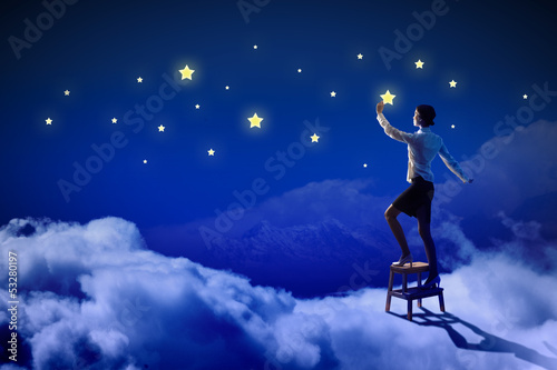 Photo: Woman lighting stars Woman lighting stars