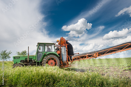 Photo: tractor spraying pesticides tractor spraying pesticides