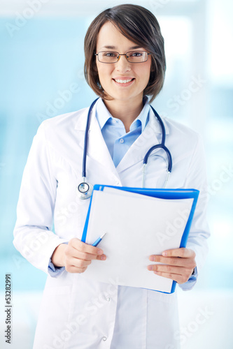 Photo: Clinician with documents Clinician with documents
