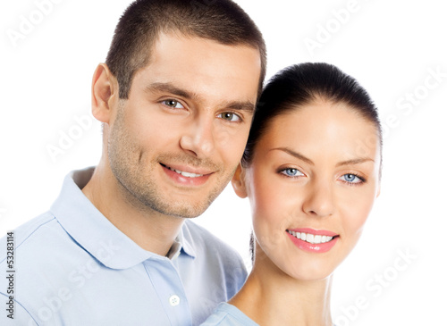 Photo: Young happy smiling couple, isolated Young happy smiling couple, isolated