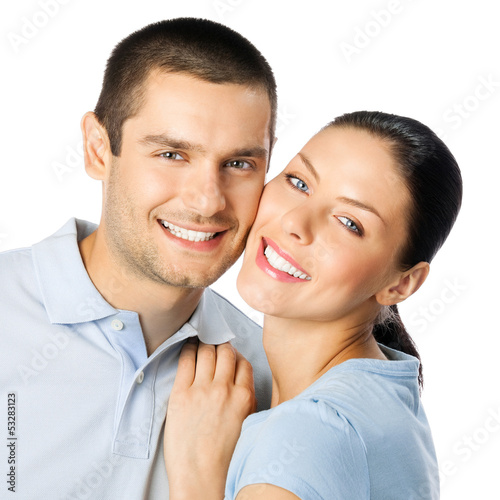 Photo: Young happy smiling couple, isolated Young happy smiling couple, isolated