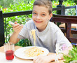 Child eating at cafe