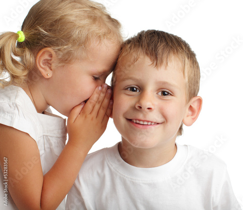 Photo: Girl whispers a secret Girl whispers a secret