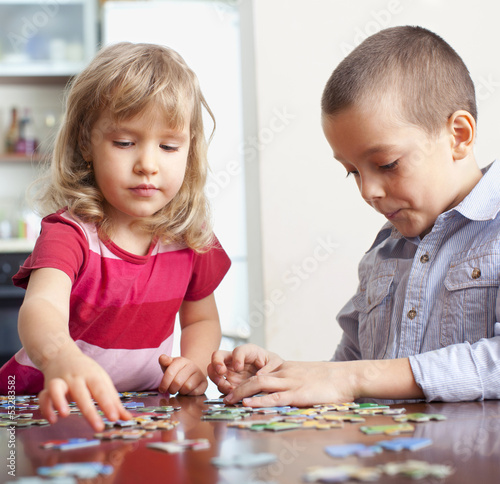 Photo: Children, playing puzzles Children, playing puzzles
