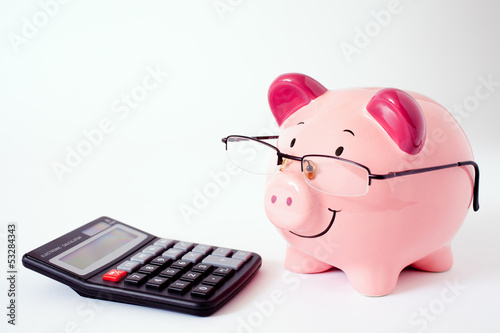 Photo: Pink Piggy Bank With Calculator. Pink Piggy Bank With Calculator.