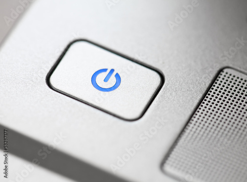 Photo: Silver power button close-up Silver power button close-up