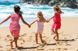 Three girlfriends having fun on beach.