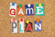 The words Game Plan on a cork notice board