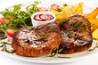 Photo: Grilled steaks, baked potatoes and vegetables Grilled steaks, baked potatoes and vegetables