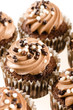 Chocolate cupcakes with chocolate icing and decoration isolated