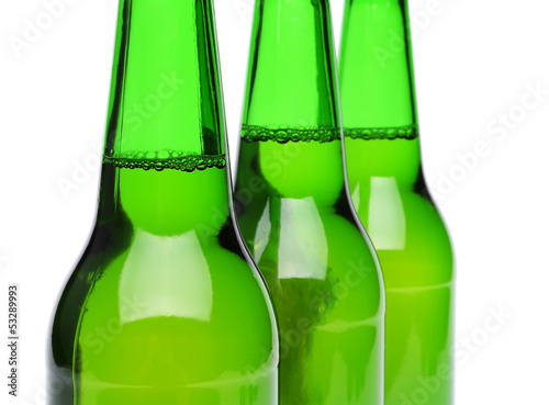 Photo: Three bottles of beer close-up Three bottles of beer close-up
