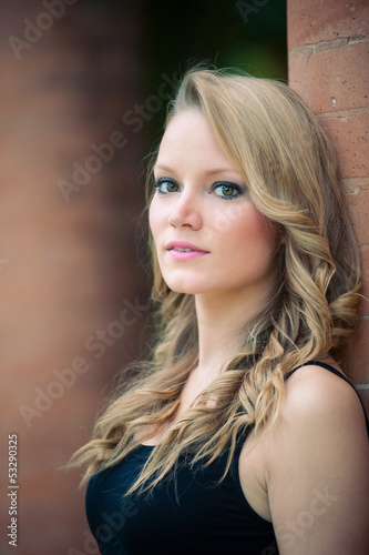 Photo: Beautiful girl outdoors intimate portrait. Beautiful girl outdoors intimate portrait.