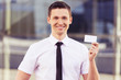 businessman showing blank business card