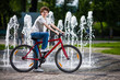 Photo: Urban biking - teenage boy and bike in city Urban biking - teenage boy and bike in city