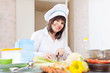woman cooking at kitchen