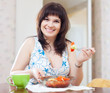  woman eats vegetables