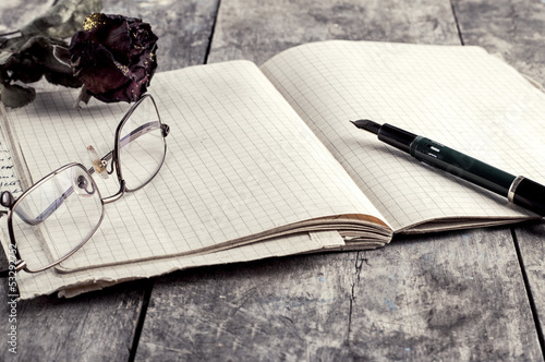 Photo: dried rose on old notebook dried rose on old notebook