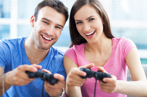 Photo: Couple playing video games Couple playing video games