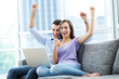 Couple on sofa with laptop