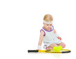 Photo: Baby in tennis clothes with racket and balls Baby in tennis clothes with racket and balls