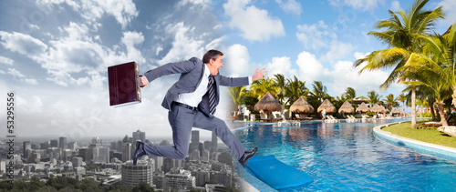 Photo: Businessman jumping on the water. Businessman jumping on the water.
