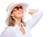Photo: Woman wearing sunglasses and a hat. Woman wearing sunglasses and a hat.