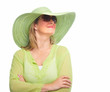 Woman wearing sunglasses and a hat.