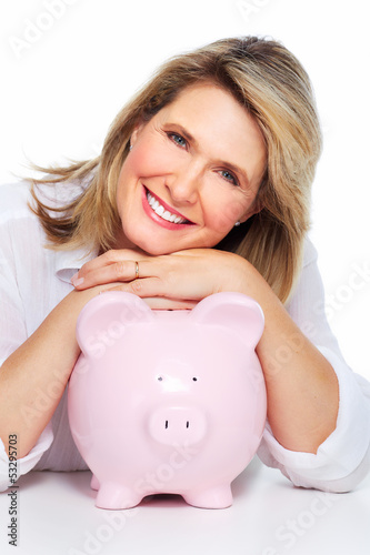 Photo: Senior woman with a piggy bank. Senior woman with a piggy bank.