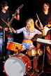 Band playing musical  instrument.