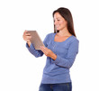 Pretty woman working on tablet pc while standing