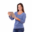 Pretty female working on tablet pc while standing