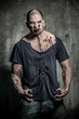 Photo: a scary and bloody zombie man a scary and bloody zombie man