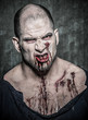 Photo: a scary and bloody zombie man a scary and bloody zombie man
