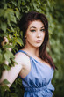 fashion brunette posing outdoors