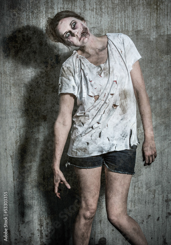 Photo: a scary and bloody zombie a scary and bloody zombie