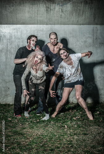 Photo: scary bloody zombies waiting for a prey scary bloody zombies waiting for a prey