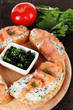 Photo: Fish sandwiches on cutting board on wooden table Fish sandwiches on cutting board on wooden table