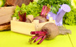 Young beets on wooden box on wooden table close-up