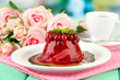Tasty jelly dessert with fresh berries, on bright background