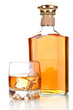Glass of brandy and bottle isolated on white
