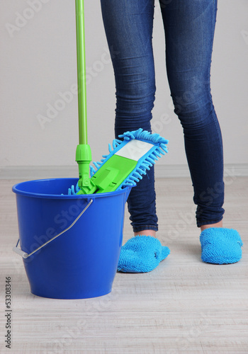 Photo: Cleaning floor in room close-up Cleaning floor in room close-up