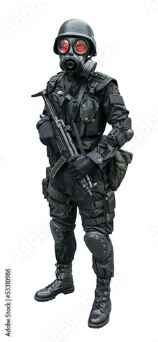 Photo: Special force soldier standing in isolation background Special force soldier standing in isolation background