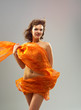 Beautiful woman in  waving fabric.