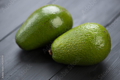Photo: Two ripe avocados, horizontal shot Two ripe avocados, horizontal shot