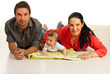 Happy family lying down on floor