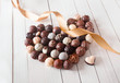 Photo: Heart made with chocolate truffles with a ribbon Heart made with chocolate truffles with a ribbon