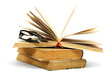 Foto: Stack of old books and glasses on a white background. Stack of old books and glasses on a white background.