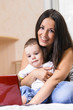 mother and son are using laptop
